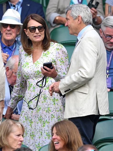 Carole Middleton serves at Wimbledon in daughter Pippa's sunglasses .